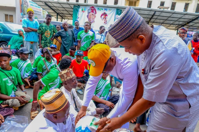APC officials in FCT distributing food items to persons with disabilities