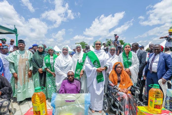 Wife of the Vice President and representative of the First Lady of Nigeria, Hajia Nana Shettima (middle) with other dignitaries and some of the beneficiaries of the RHI Food Outreach Programin Bauchi State on Saturday 22nd August, 2026